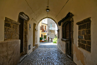 Old houses on a narrow street in maenza, a medieval village near rome in italy.