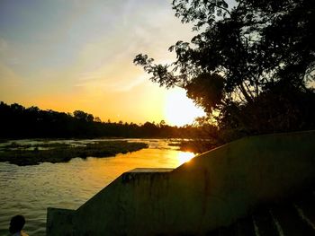 Scenic view of lake against sky during sunset