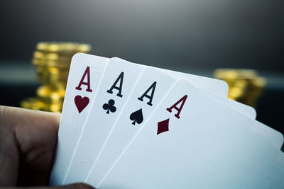 Close-up of man holding cards