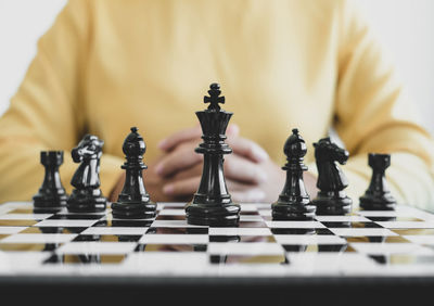 Close-up of chess playing on table