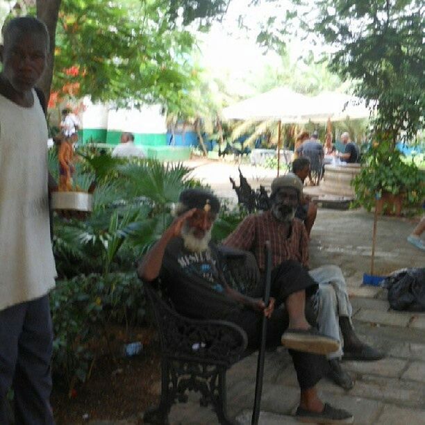 WOMAN SITTING ON BENCH