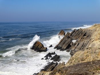 Scenic view of sea against clear blue sky