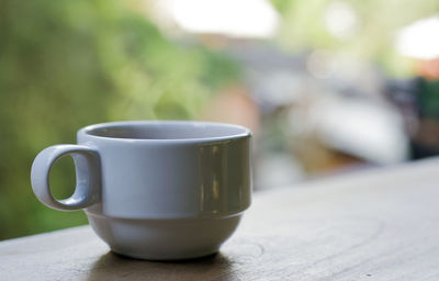 Close-up of coffee cup on table