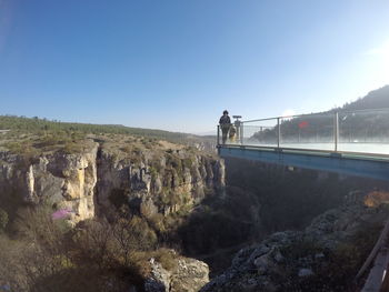 Woman with son standing at observation point