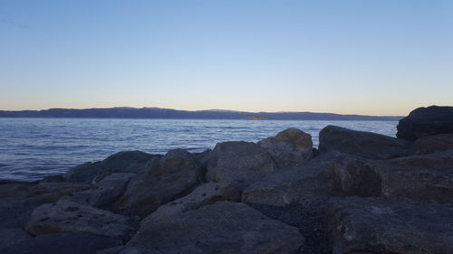 Scenic view of sea against clear sky