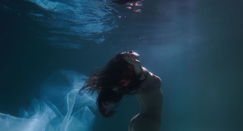 Woman swimming in pool