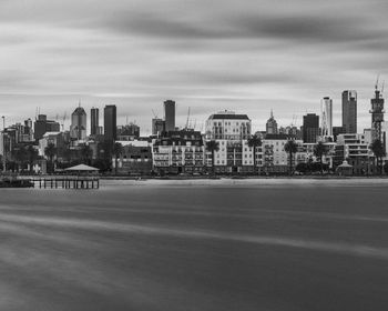 City by buildings against sky