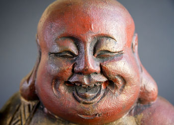 Close-up portrait of smiling statue