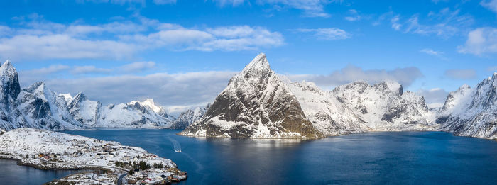 Scenic view of lake against sky during winter