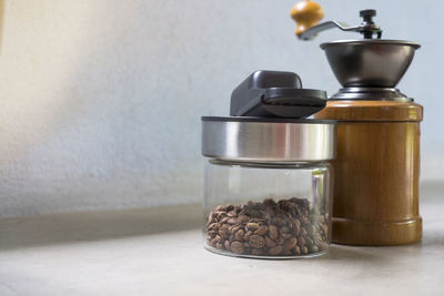 Close-up of coffee beans in glass on table
