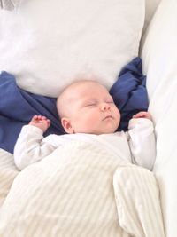 Cute baby sleeping on bed