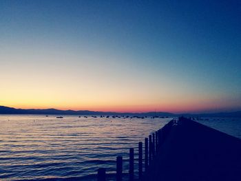 Scenic view of calm sea at sunset