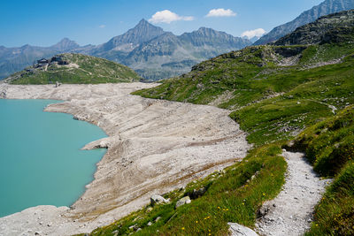 Hiking trail along the weißsee, hohe tauern, austria. view to the mountain hotel rudolfshütte.