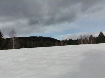 Scenic view of landscape against sky during winter