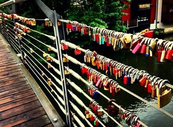 Row of padlocks on wooden post