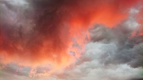 Low angle view of dramatic sky during sunset