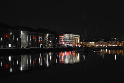 Reflection of illuminated buildings in water at night