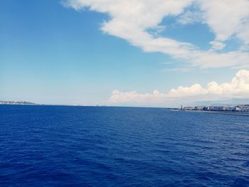 Scenic view of sea against blue sky