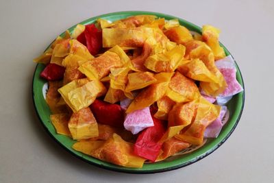 High angle view of chopped fruits in bowl on table