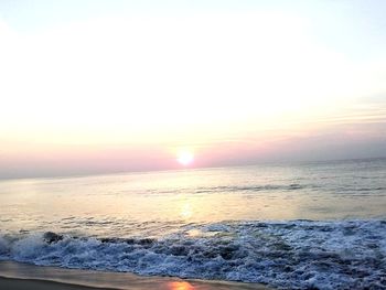 Scenic view of sea against clear sky during sunset
