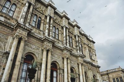 Low angle view of dolmabahce palace against sky in city