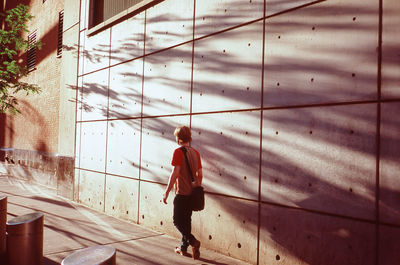 Woman standing by railing