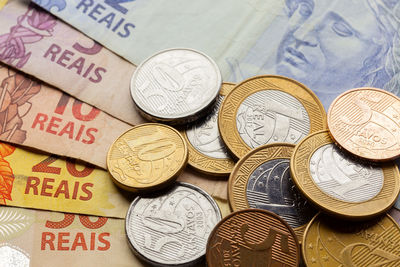 High angle view of coins on table