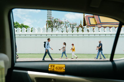 People seen through glass window