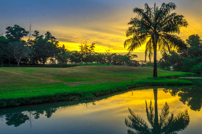 Scenic view of lake against sky during sunset