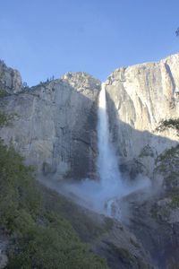 Low angle view of lower yosemite falls against clear sky