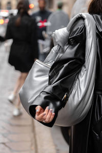 Rear view of woman standing in city