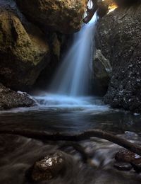 Scenic view of waterfall at night