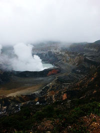 Aerial view of volcanic landscape against sky