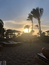 View of swimming pool at beach during sunset