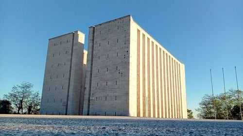Low angle view of building against blue sky