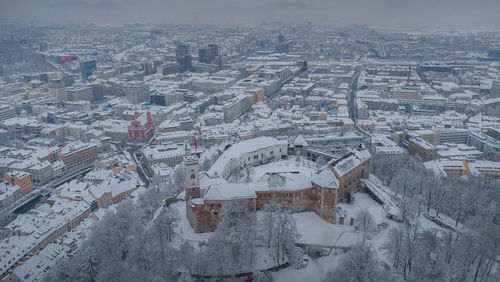 High angle view of buildings in city during winter