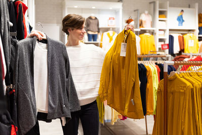 Woman comparing dressed in shopping mall