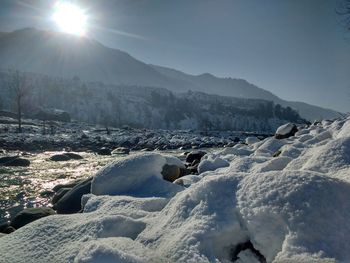 Scenic view of landscape against sky during winter