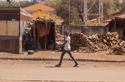 Side view of woman walking on street