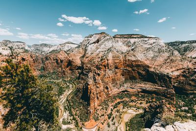 Panoramic view of trees and mountains against sky