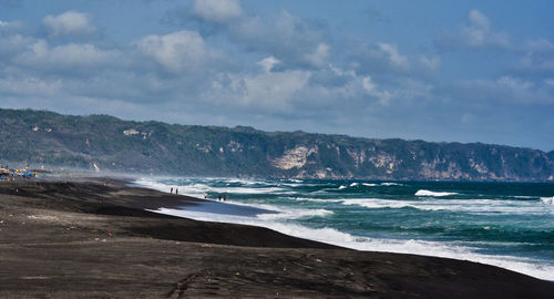 Scenic view of beach against sky