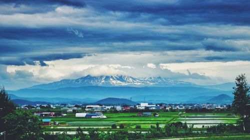 Scenic view of mountains against cloudy sky