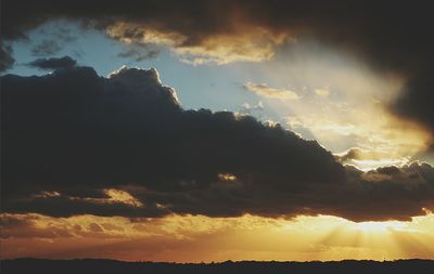 Scenic view of landscape against cloudy sky
