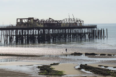 Pier on sea against sky