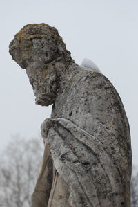 Low angle view of statue against sky