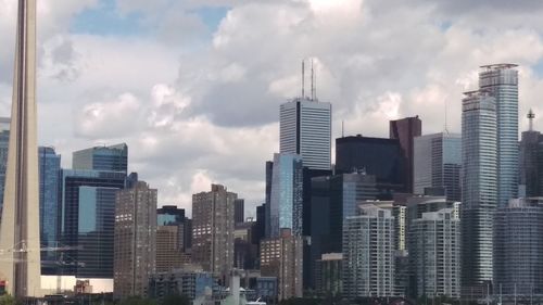 Modern buildings in city against sky