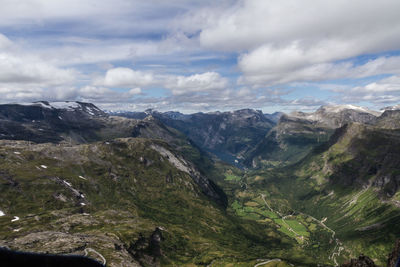 Scenic view of mountains against cloudy sky