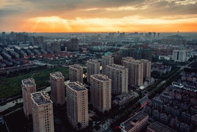 Aerial view of city at sunset