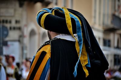 Rear view of man wearing traditional clothing during festival