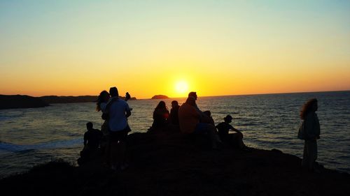 Sunset by sea with friends